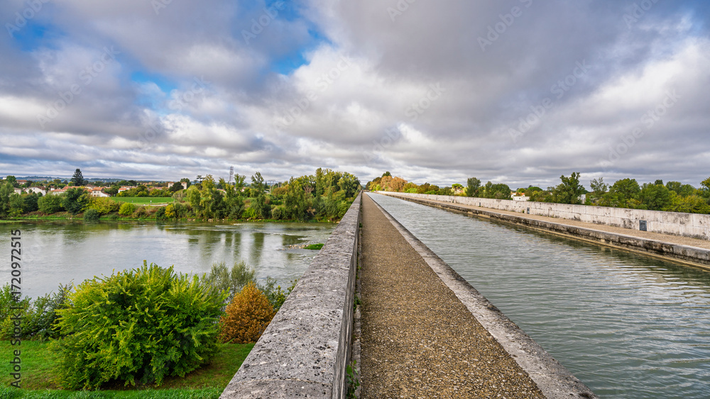 Fototapeta premium Scenic landscape view of famous Pont-Canal navigable aqueduct over Garonne river, Agen, Lot-et-Garonne, France