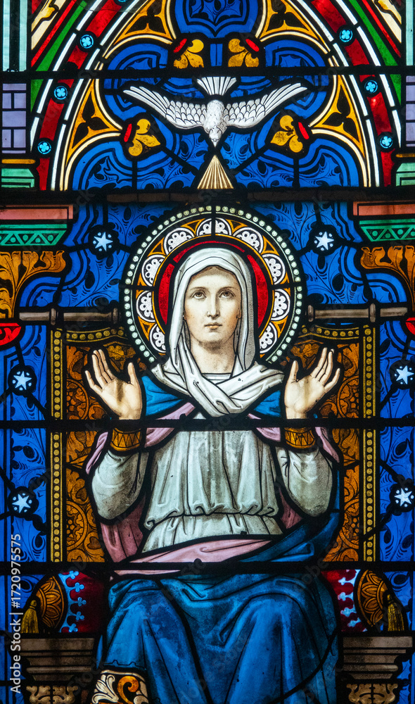 Fototapeta premium Stained glass (19th century) of Virgin Mary at prayer.