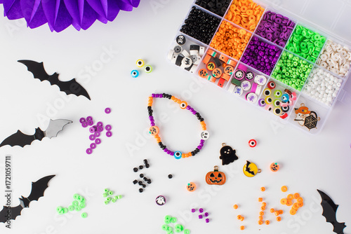A set of multicolored beads for making handmade Halloween bracelets. 