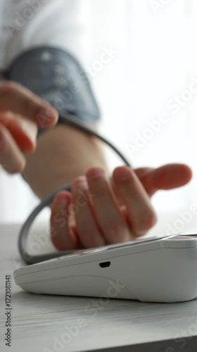 Checking blood pressure with a digital tonometer.
A man with high blood pressure measures his blood pressure and pulse.
Heart problems.
Blood pressure monitor, measurement, pulse, heart, blood pressur