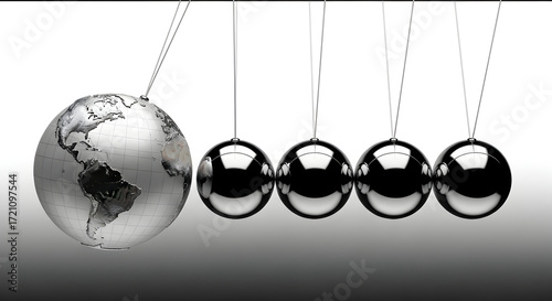 Newton’s cradle with polished globe impact ball showing global business momentum and cause‑and‑effect in world economy