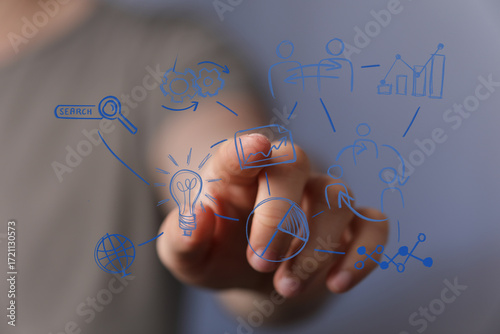 Hand pointing at digital sc...