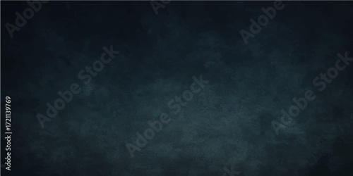 Grunge texture on an empty, dark blue chalkboard, perfect for vintage design or a blank backdrop