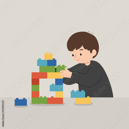 Young boy builds colorful blocks, focused on construction, neutral background