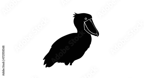 Silhouette of a shoebill stork a distinctive african bird with a unique large bill standing alertly