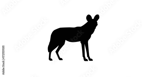 Silhouette of african wild dog standing profile view isolated on