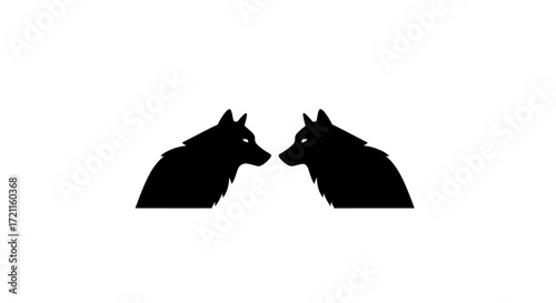 Two silhouette wolves facing each other symbolizing pack unity and wild nature spirit