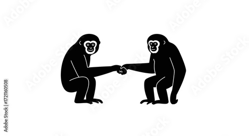 Two black gibbons in a friendly handshake pose symbolizing connection and unity