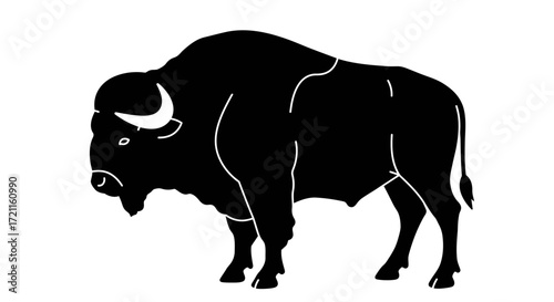 Powerful silhouette of a bison standing majestically showing its strong form and curved horns