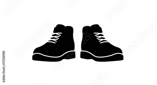 Pair of black lace-up hiking boots with white laces and thick soles isolated on white