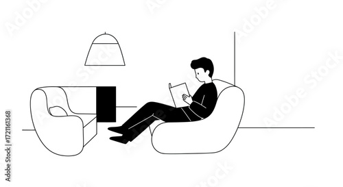 Relaxed man reading a book on a large beanbag chair in a modern living room setting