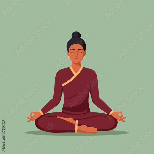 Woman in maroon robe meditating in lotus position on a light green background