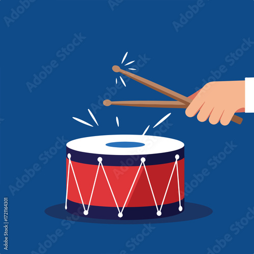 Drum with red design and sticks