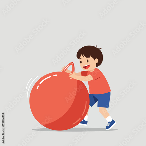 Boy, smiling, plays with a large red bouncy ball on a light gray floor