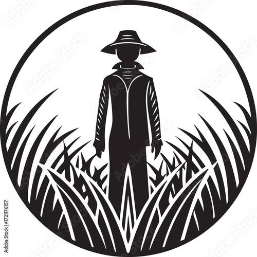 Silhouette of a farmer in a hat standing in tall grass