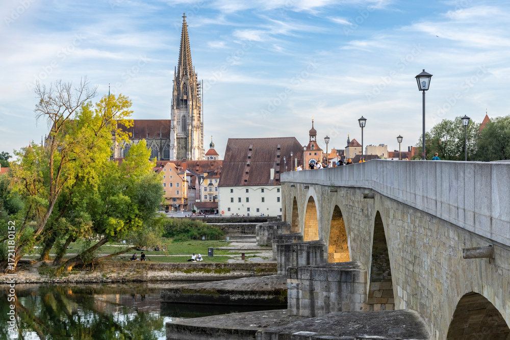 Stone bridge over the Danube and cathedral in Regensburg Germany