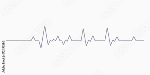 Green EKG wave graph showing a heartbeat rhythm on a monitor screen for medical health care in a hospital