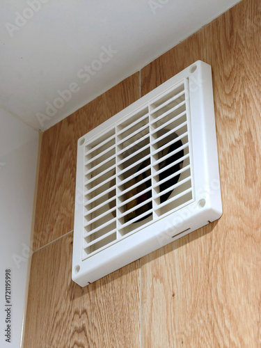 Close up of Bathroom ventilation fan in modern interior design apartment. Air circulation, suggesting ventilation, airflow in a residential space