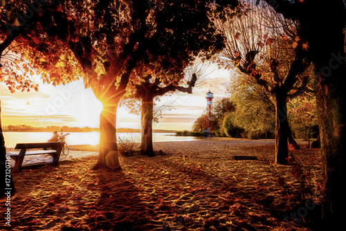 Relaxing on a bench  near the lighthouse of Hamburg Wittenberge in beautiful autumn sunlight