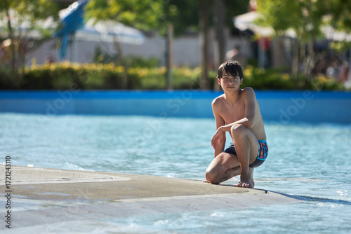 Canvastavla Boy enjoys summer fun at water park