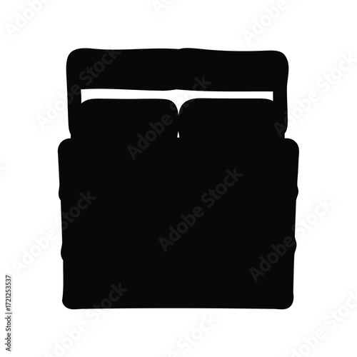 A Dark Silhouette of a Bed with Headboard and Two Pillows