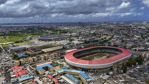 Aerial view of the National Stadium and Teslim Balogun Stadium stand boldly against a backdrop of dense urban sprawl, Lagos, Lagos, Nigeria.