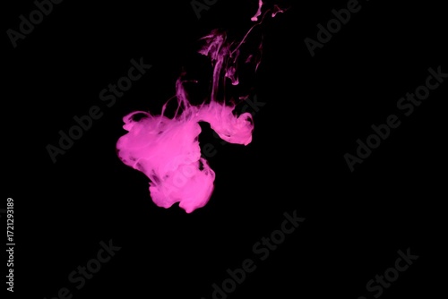 Pink colorful fluorescent smoke on black background,Art abstract smoke texture,Colored liquid dye,Splash paint,Abstract color,Abstract Textures
