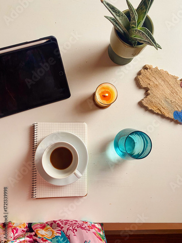 Flat Lay of Digital Tablet, Coffee , Candle, Notepad, Glass of Water and Zebra Haworthia on White Table, Freelance Lifestyle