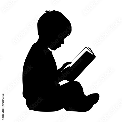 Silhouette of a young child sitting cross legged and engrossed in reading a book isolated on transparent background