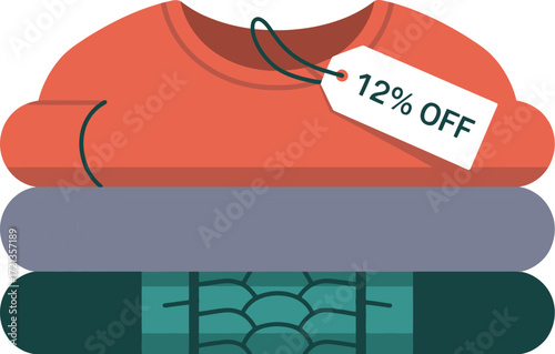 Stack of folded clothes with a sale tag attached