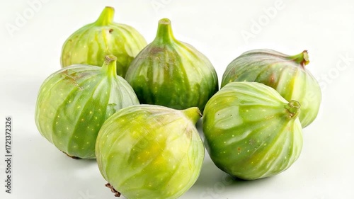 Wallpaper Mural Fresh green figs arranged on a clean white surface Torontodigital.ca