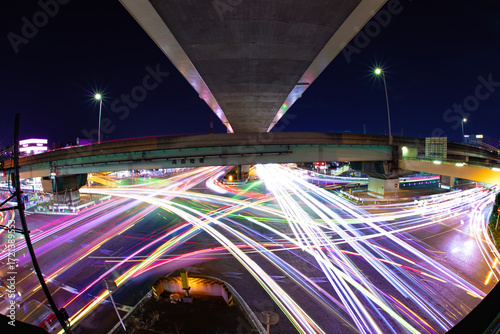 A night photography of traffic jam under the city overpass in Tokyo fish eye shot