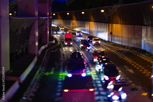 A night photography of miniature traffic jam under the city overpass in Tokyo