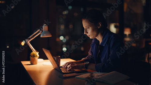 Woman workaholic typing laptop at night office closeup. Tired accountant work 