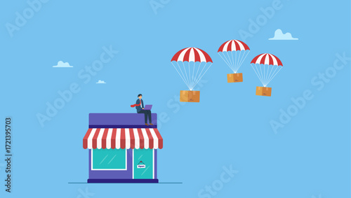 Businessman using computer with delivery drop ship package flying parachute. Dropshipping business model by open e-commerce website store and let supplier ship product directly to customer.