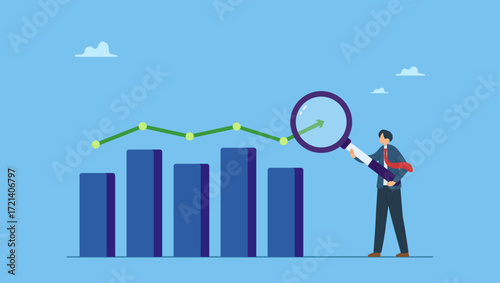 Businessman analyst analyze trend graph and chart with magnifying glass. Trend analysis, marketing and sales information, analyze or predict trend line or profit, business forecast report.