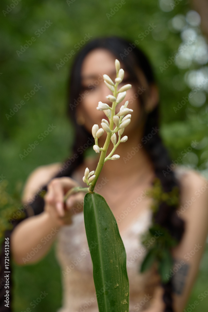 Obraz premium Female model posing in lace gown outdoors.