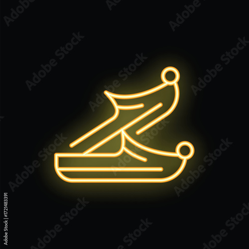 Yellow neon sign of traditional turkish shoes yemeni glowing on a black background