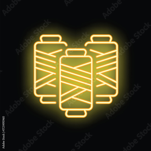 Yellow neon icon of three spools of thread glowing on black background, perfect for crafts, sewing, and tailoring