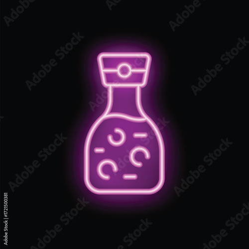 Neon sign of a sesame oil bottle glowing brightly against a dark background