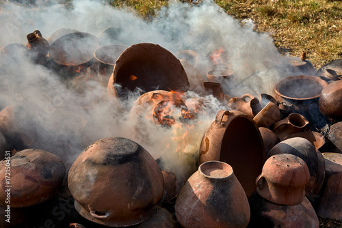 Slika na platnu the firing process of clay pottery in Huancas brings earth to life