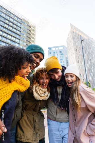 Wallpaper Mural Young students enjoying winter outdoors, having fun sharing laughter and friendship. Moments of joy and togetherness in the city. Student lifestyle concept. Torontodigital.ca