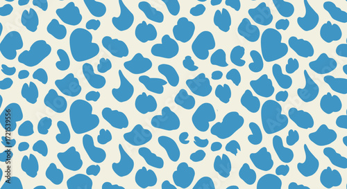 A seamless pattern of blue irregular shapes resembling cow spots on a light cream background, creating a playful and abstract texture suitable for various design applications