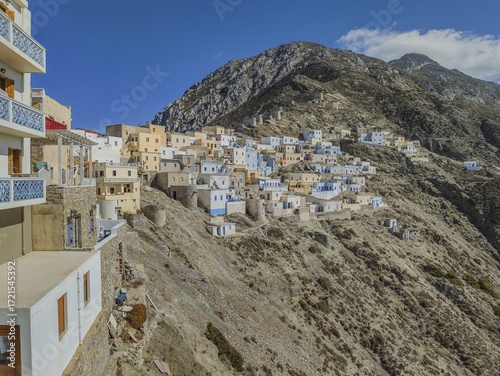 Traditional village of Olymbos on a steep slope with characteristic, closely-knit houses, Olymbos, Karpathos, Greece