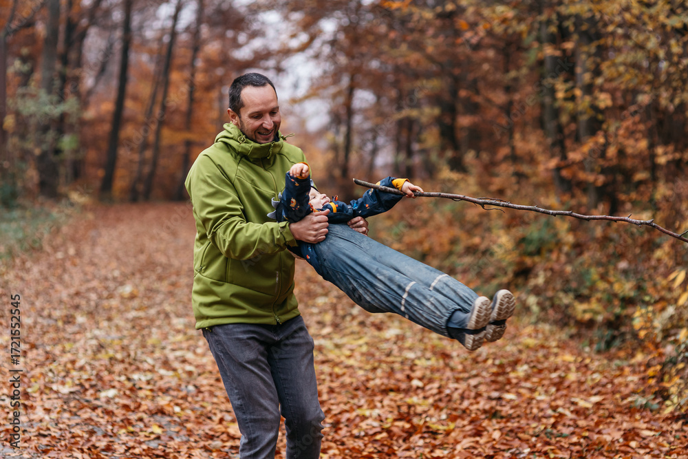 Fototapeta premium Father and son bonding. Autumn fall images. 