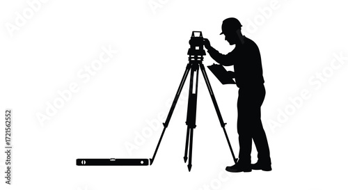 Silhouette of a surveyor using a theodolite and tripod for measurement