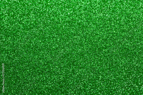 Vibrant emerald green glitter sparkle texture background with subtle shimmer