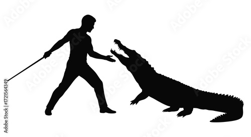 A silhouetted image of a person confronting an alligator with a stick