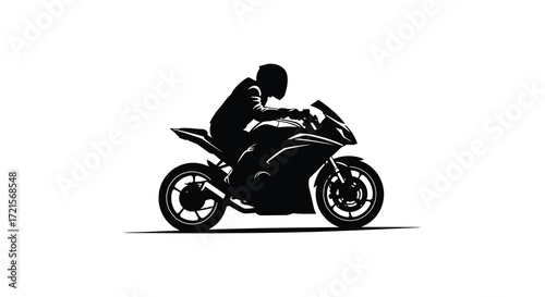 Silhouette of a motorcyclist riding a sport bike in motion