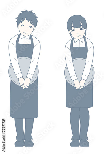 お辞儀をしながら微笑む飲食店員
